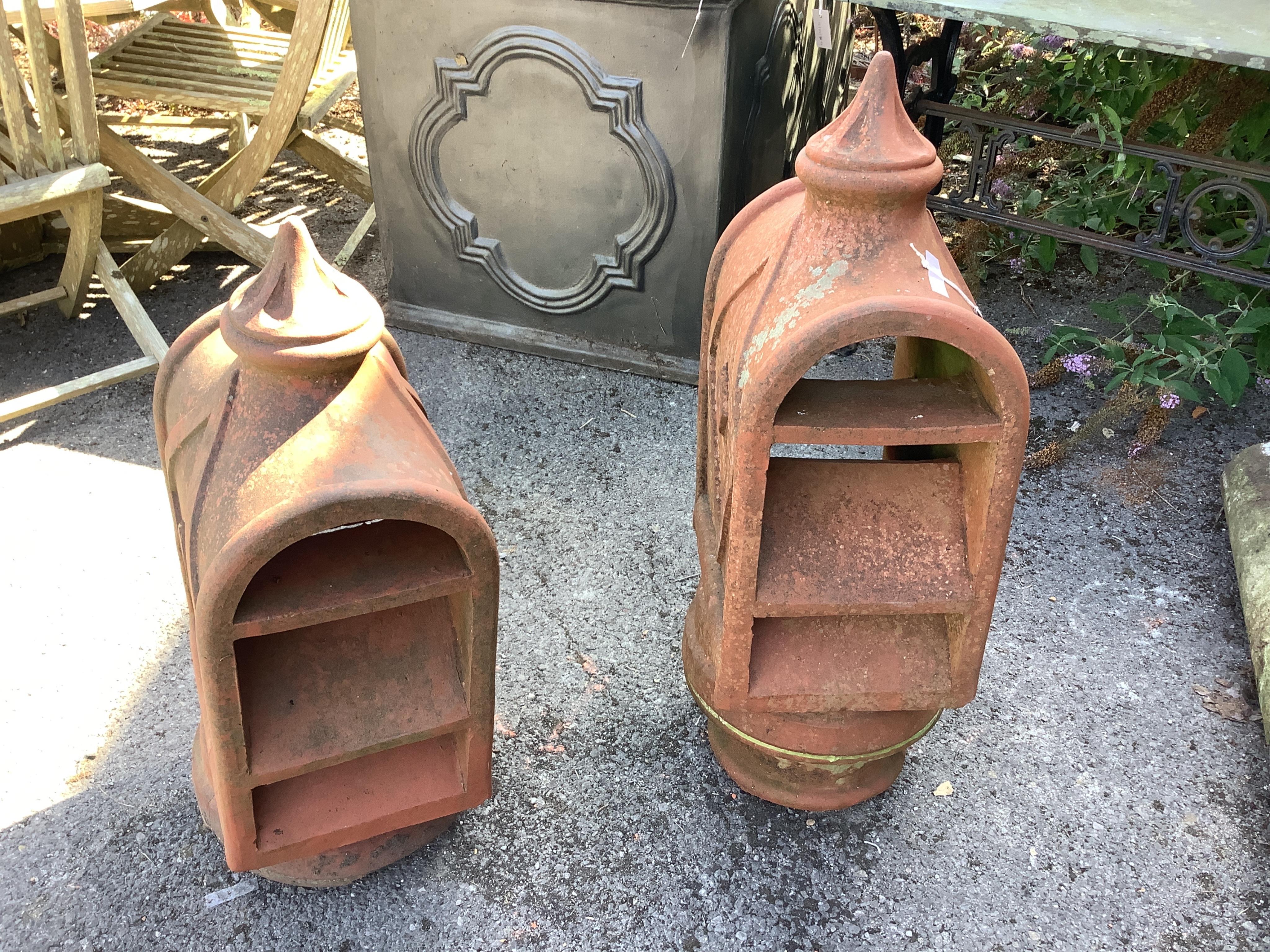 A pair of unusual terracotta chimney cowls, larger height 90cm. Condition - good